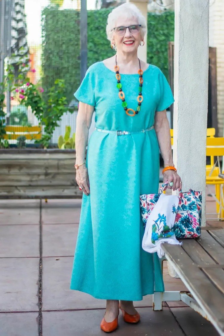 Turquoise short-sleeve maxi dress with beaded necklace