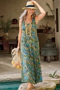 Green and blue floral halter maxi dress by the pool