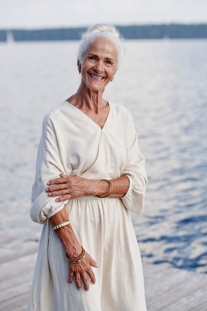 White v-neck maxi dress by the waterfront