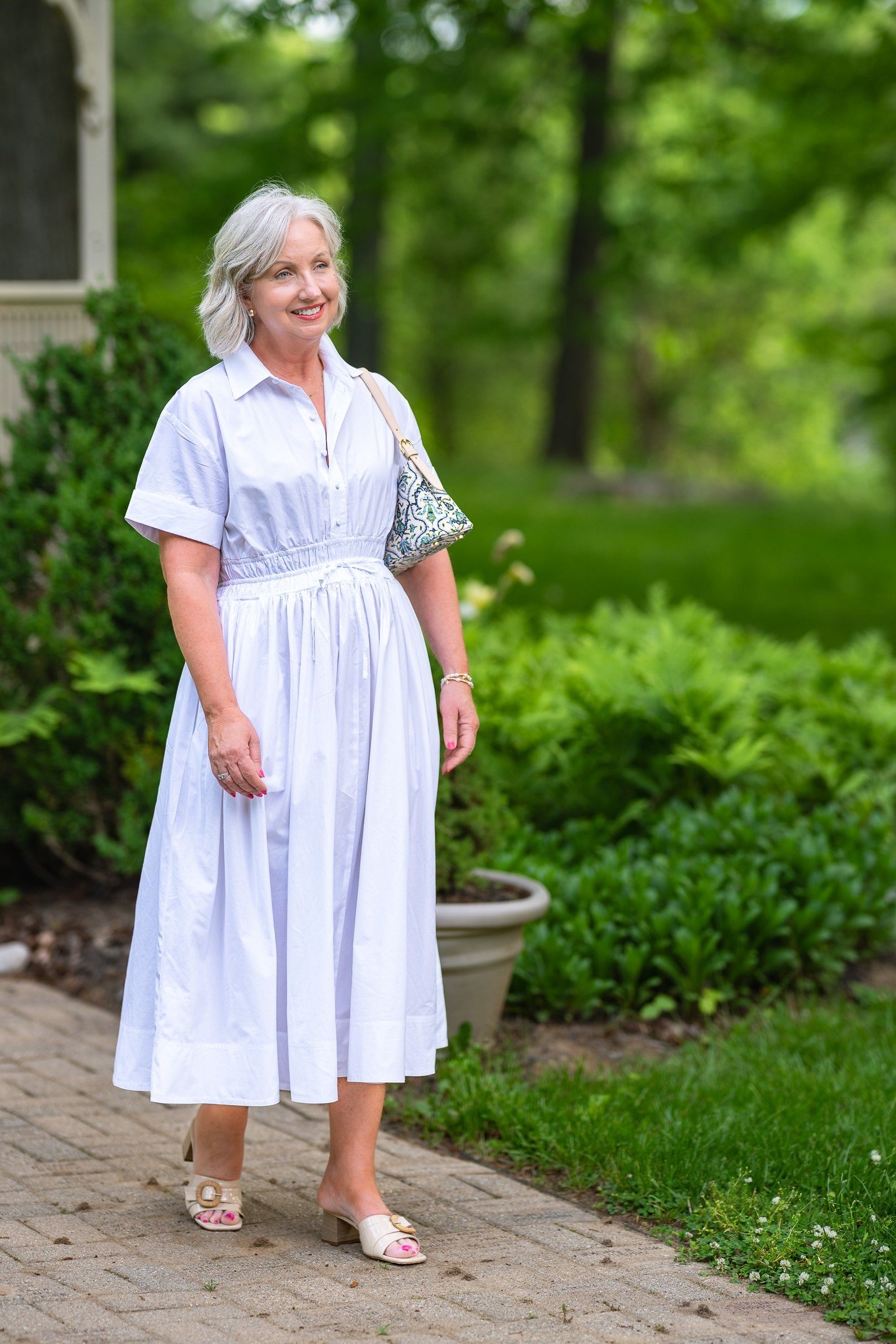 White collared shirt dress with button front in garden