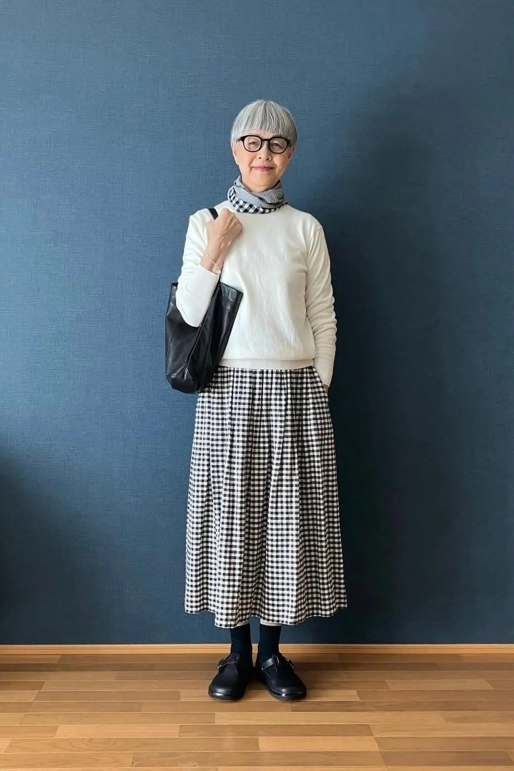 white tee with silver pleated midi skirt - classy skirt outfits for women over 60