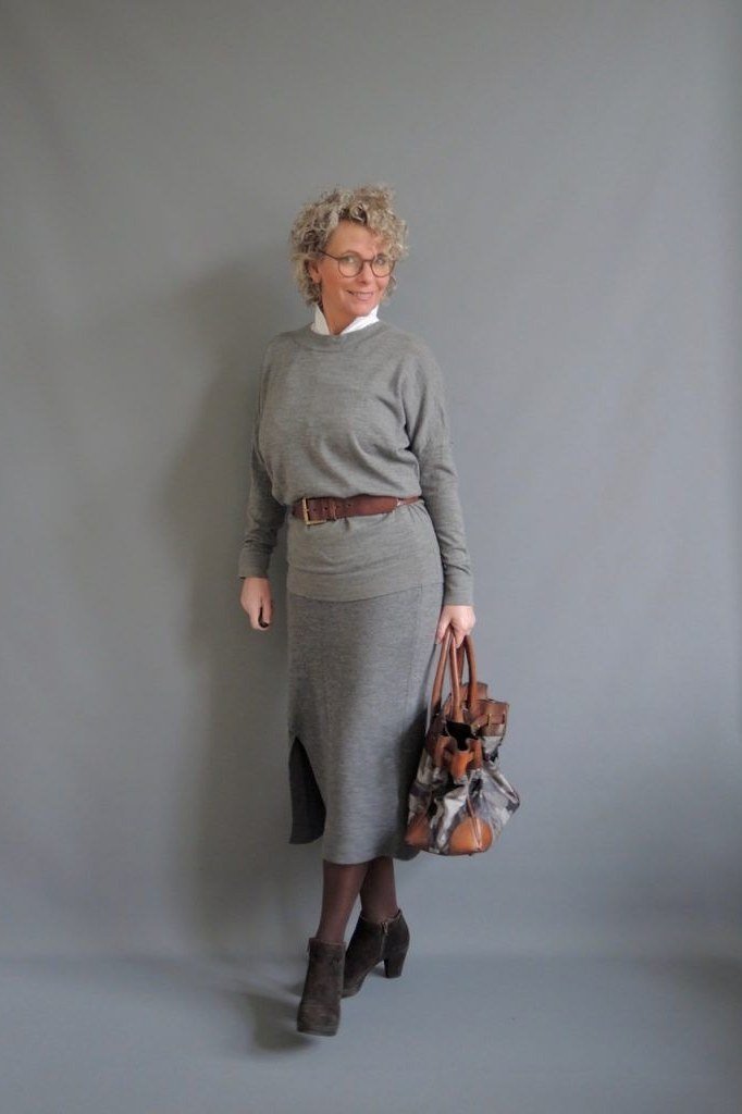champagne blouse with navy pleated midi skirt - classy skirt outfits for women over 60