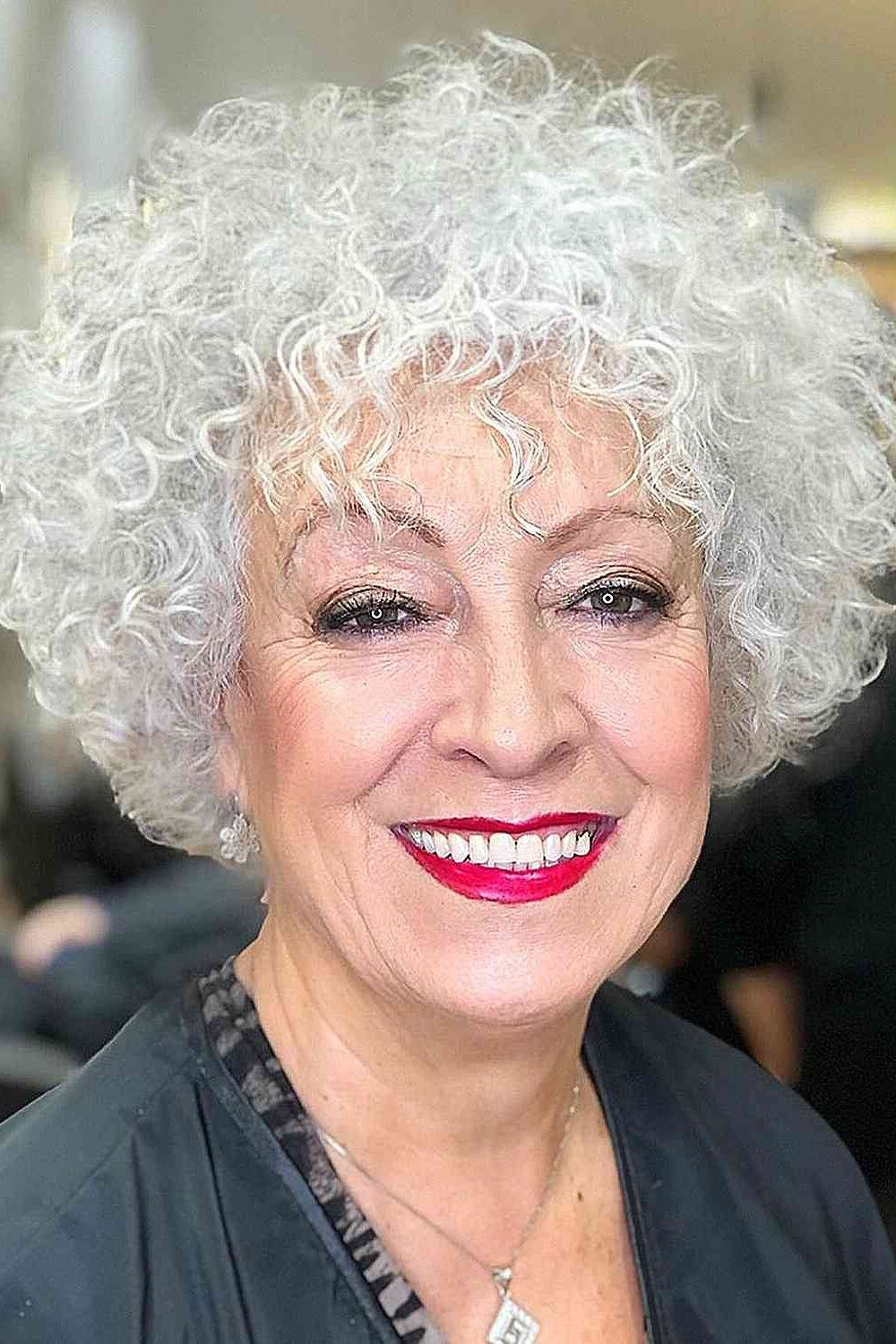 White Curly Pixie with Bangs curly bangs hairstyle for women over 60
