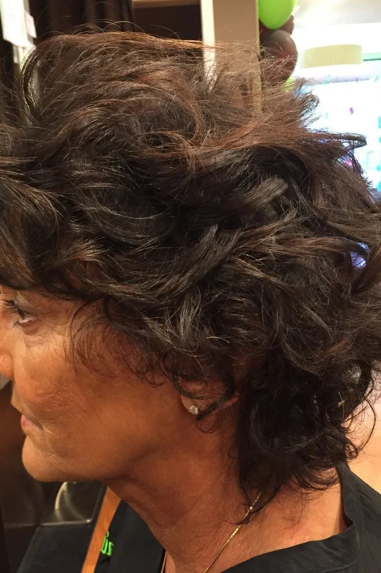 Voluminous Dark Curly Crop with Bangs curly bangs hairstyle for women over 60