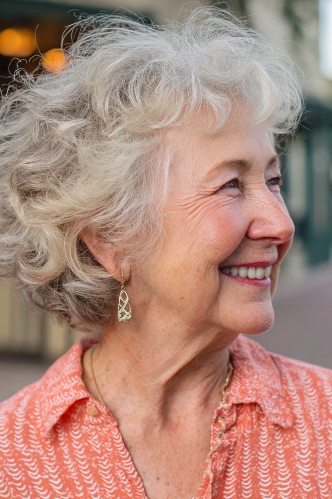 Gray Curly Pixie with Bangs curly bangs hairstyle for women over 60