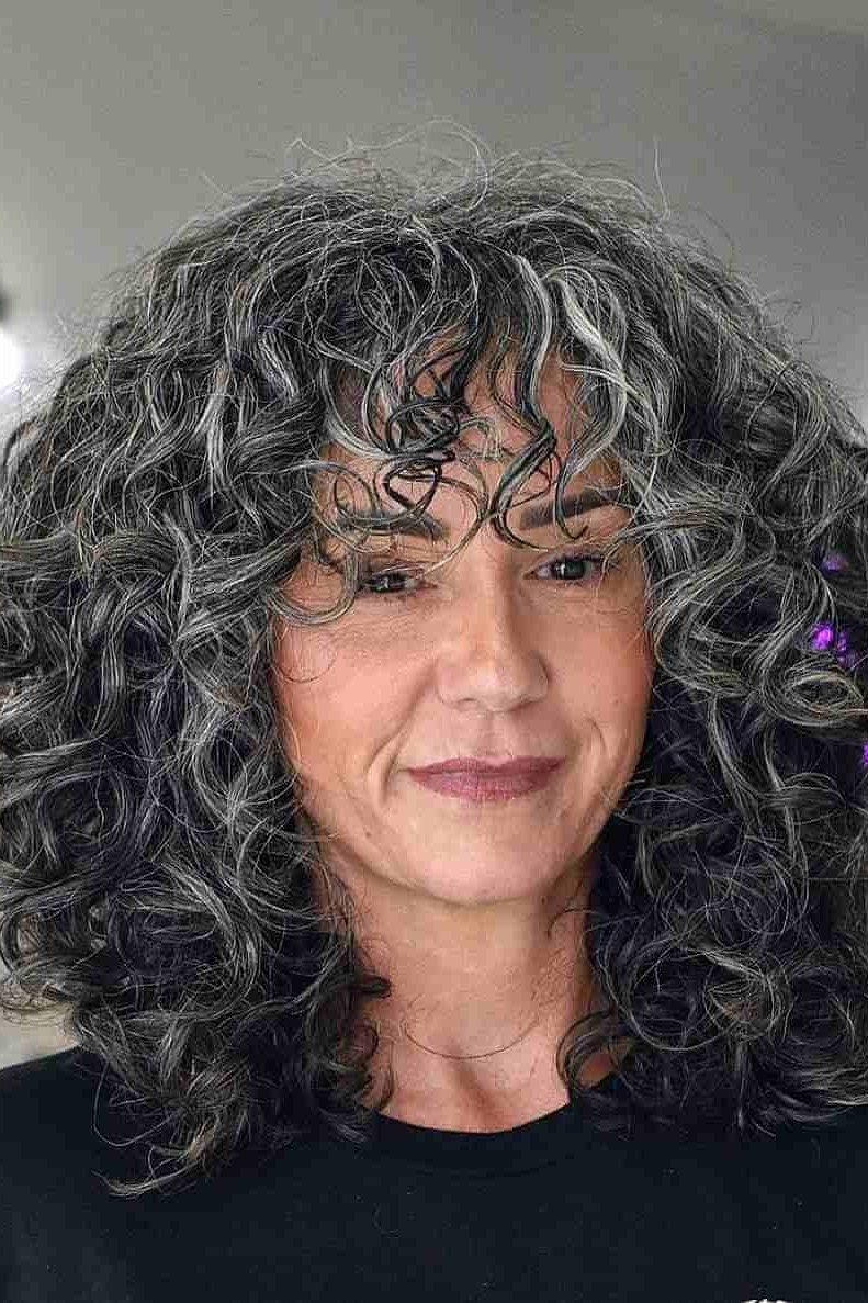 Long Dark Curly Hair with Bangs curly bangs hairstyle for women over 60