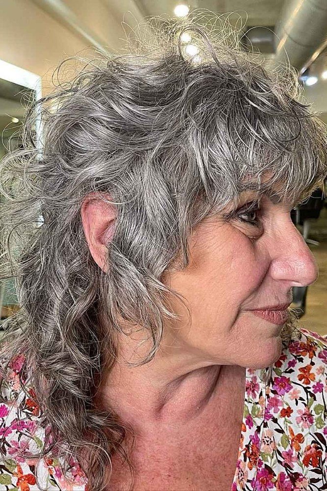 Long Gray Curly Layers with Bangs curly bangs hairstyle for women over 60