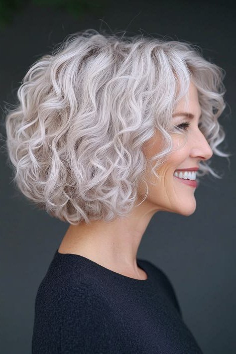 Rounded silver curly bob haircut for older women