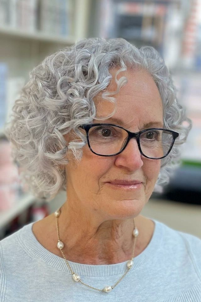 Salt and pepper curly bob with glasses for older women