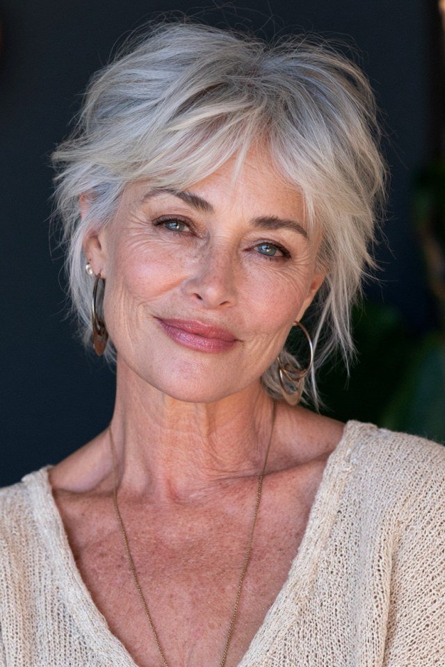 Wavy Silver Pixie-Bob with Side-Swept Bangs - silver curly gray hairstyle for older women, idea 48