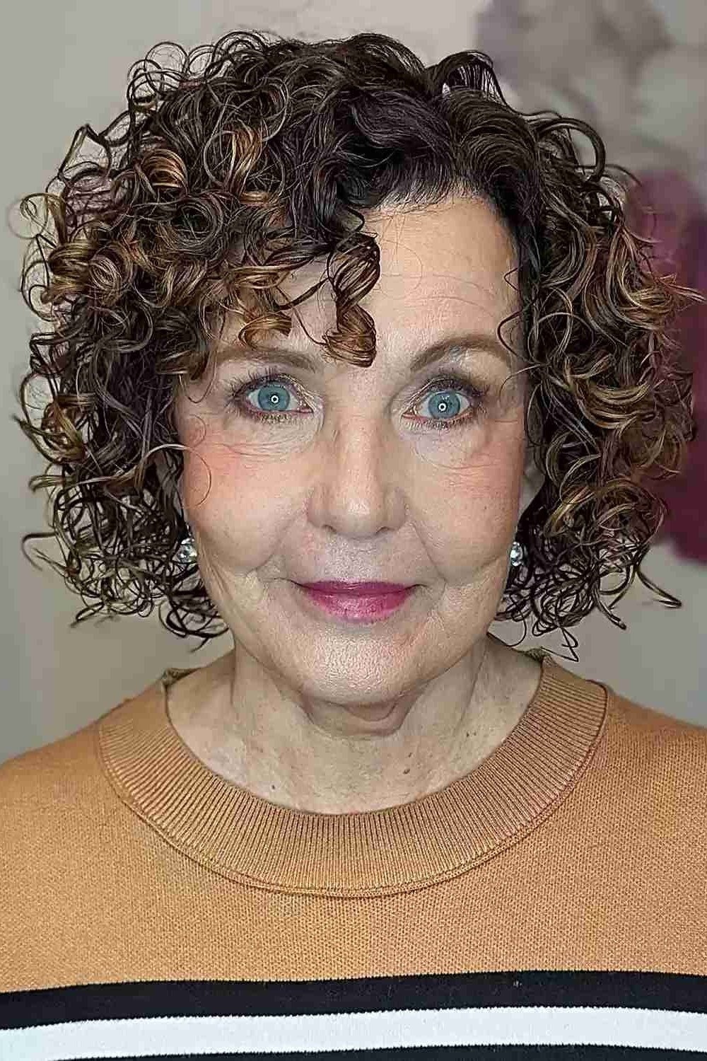 Short dark brown curly bob hairstyle for women over 60