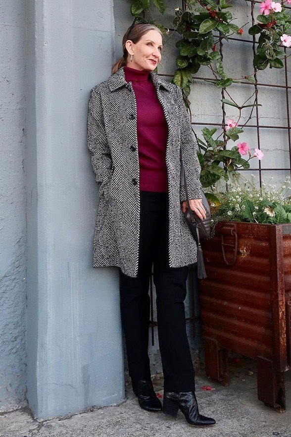 Tweed Coat with Burgundy Turtleneck by the Wall