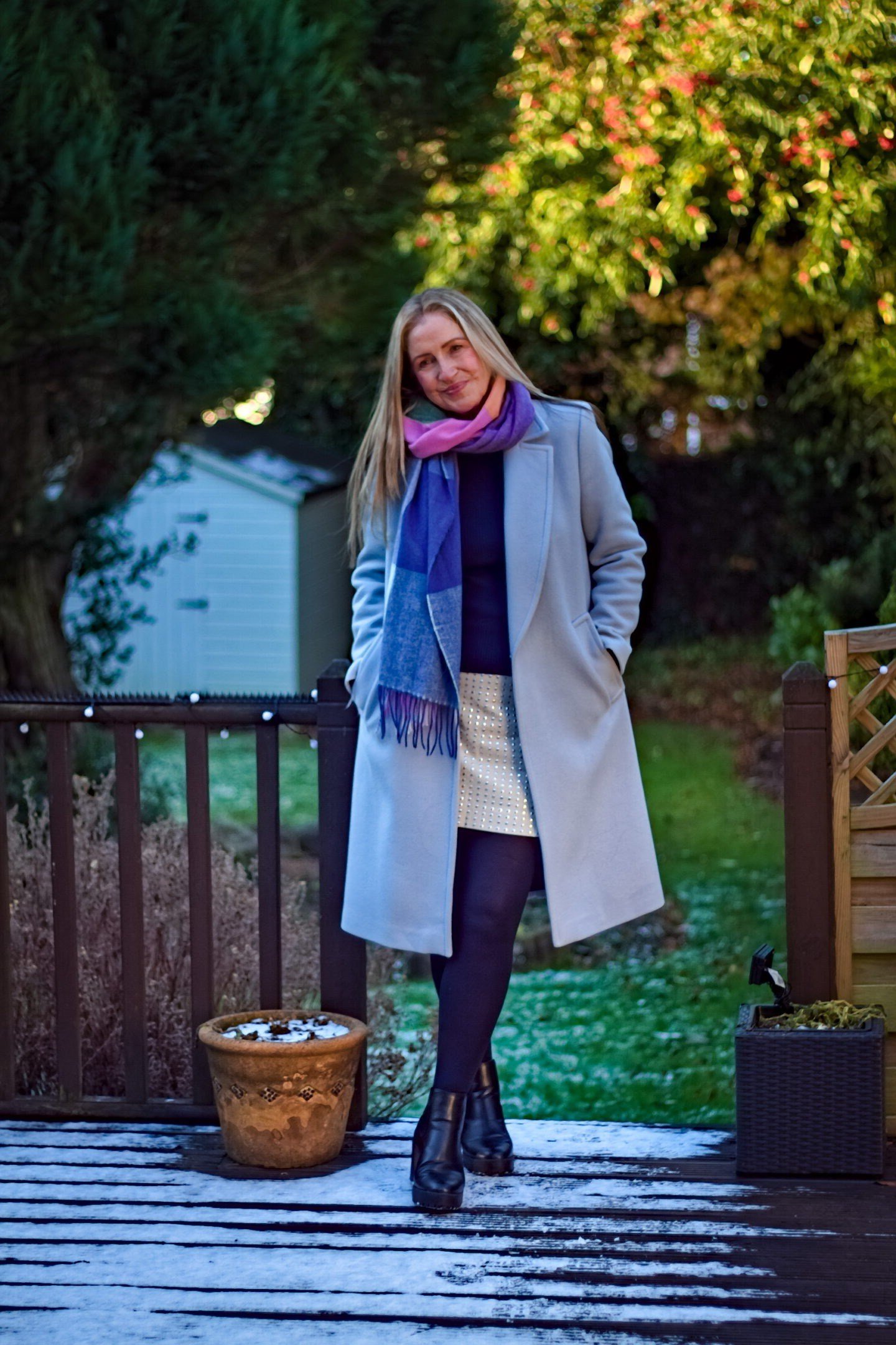 Periwinkle Coat with Purple Scarf on a Frosty Deck