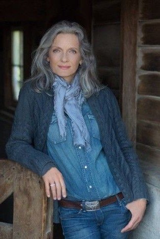 Chambray shirt, scarf, medium jeans, wooden porch - denim outfit idea for women over 50