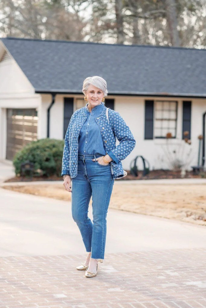 Chambray shirt, medium jeans, house exterior - denim outfit idea for women over 50