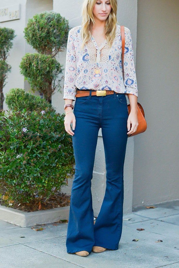 Brown turtleneck, medium jeans, straw bag, garden - denim outfit idea for women over 50