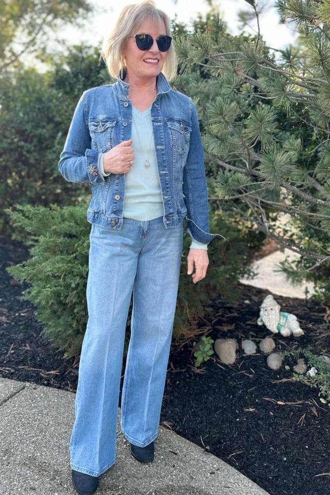 Denim jacket, light wide-leg jeans, outdoors - denim outfit idea for women over 50