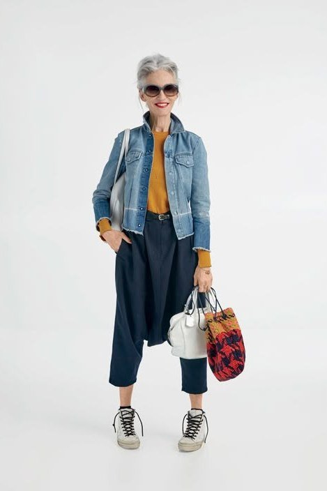 Denim jacket, mustard top, dark culottes, sneakers - denim outfit idea for women over 50