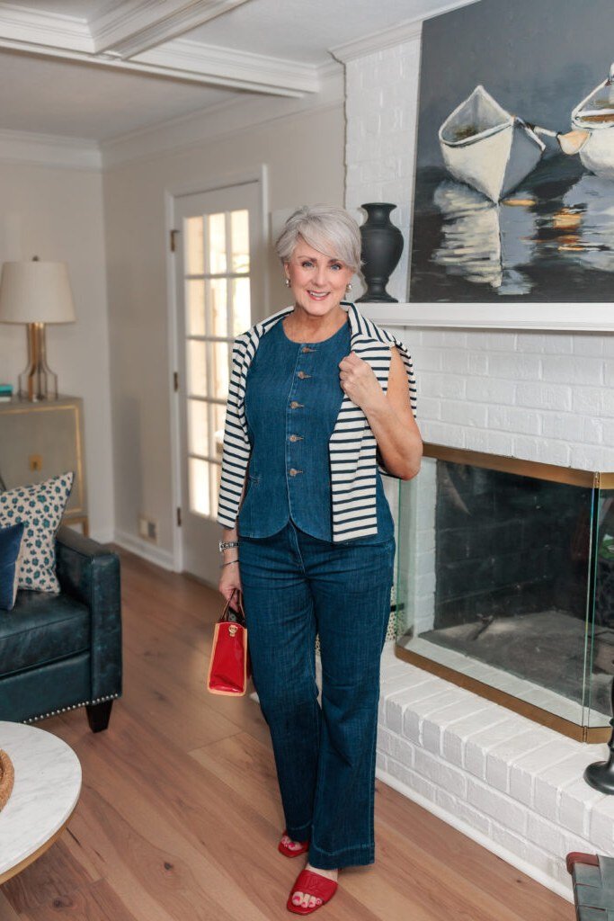 Denim vest, striped cardigan, dark jeans - denim outfit idea for women over 50