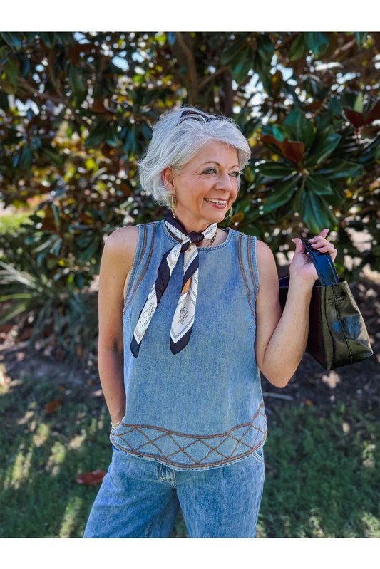 Denim vest top, scarf, medium jeans, outdoors - denim outfit idea for women over 50