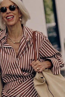 striped blouse, tan leather bag, storefront