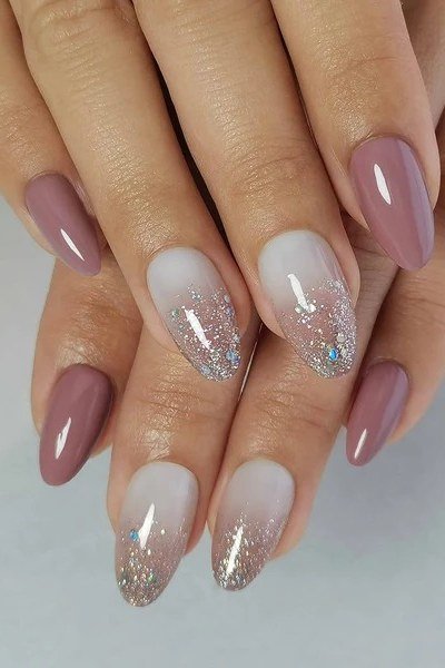 Mauve Almond Nails with a Silver Glitter Fade for women over 50