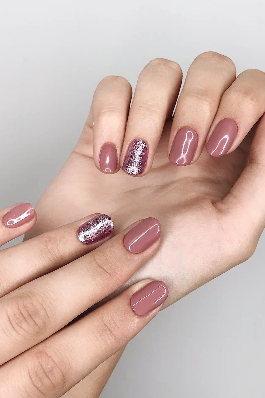 Nude Rose Nails with Gold Glitter Accents for women over 50