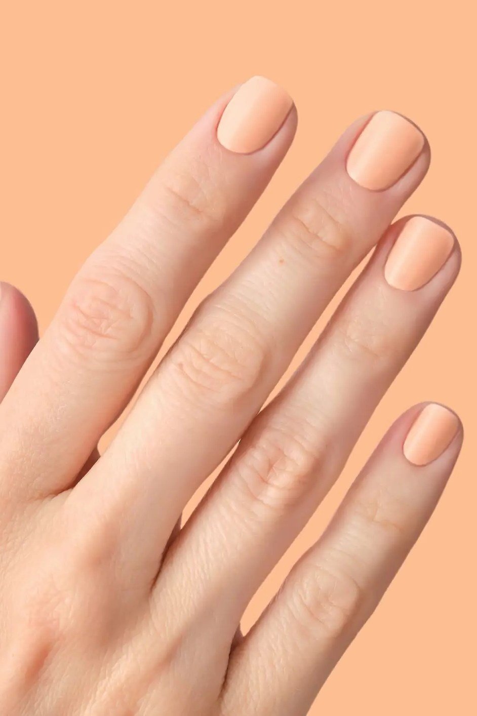 Peach Nude Oval Almond Nails - elegant almond nail idea for women over 60