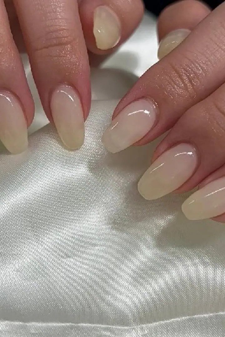 Milky Nude Almond Nails - elegant almond nail idea for women over 60