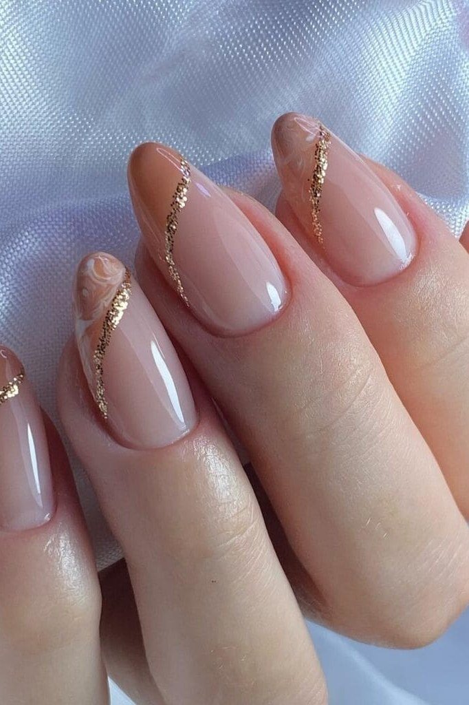 Almond Nude Nails with Thin Gold Side Lines - elegant almond nail idea for women over 60