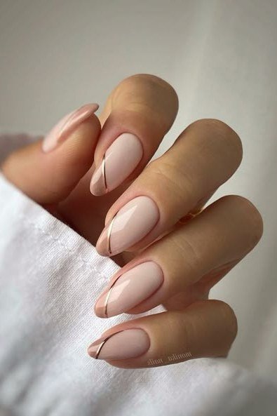 Almond Nude Nails with a Single Thin Brown Line - elegant almond nail idea for women over 60