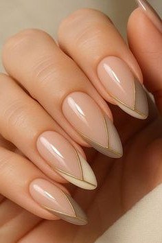 Almond Nude Nails with Gold V Shaped French Tips - elegant almond nail idea for women over 60