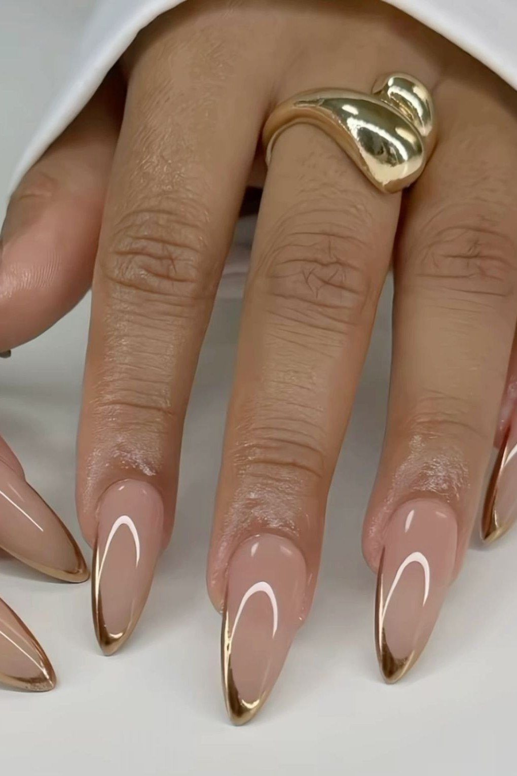 Nude Almond Nails with Gold Outline - elegant almond nail idea for women over 60