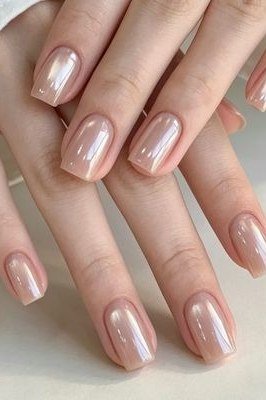 Pearl Nude Almond Nails - elegant almond nail idea for women over 60