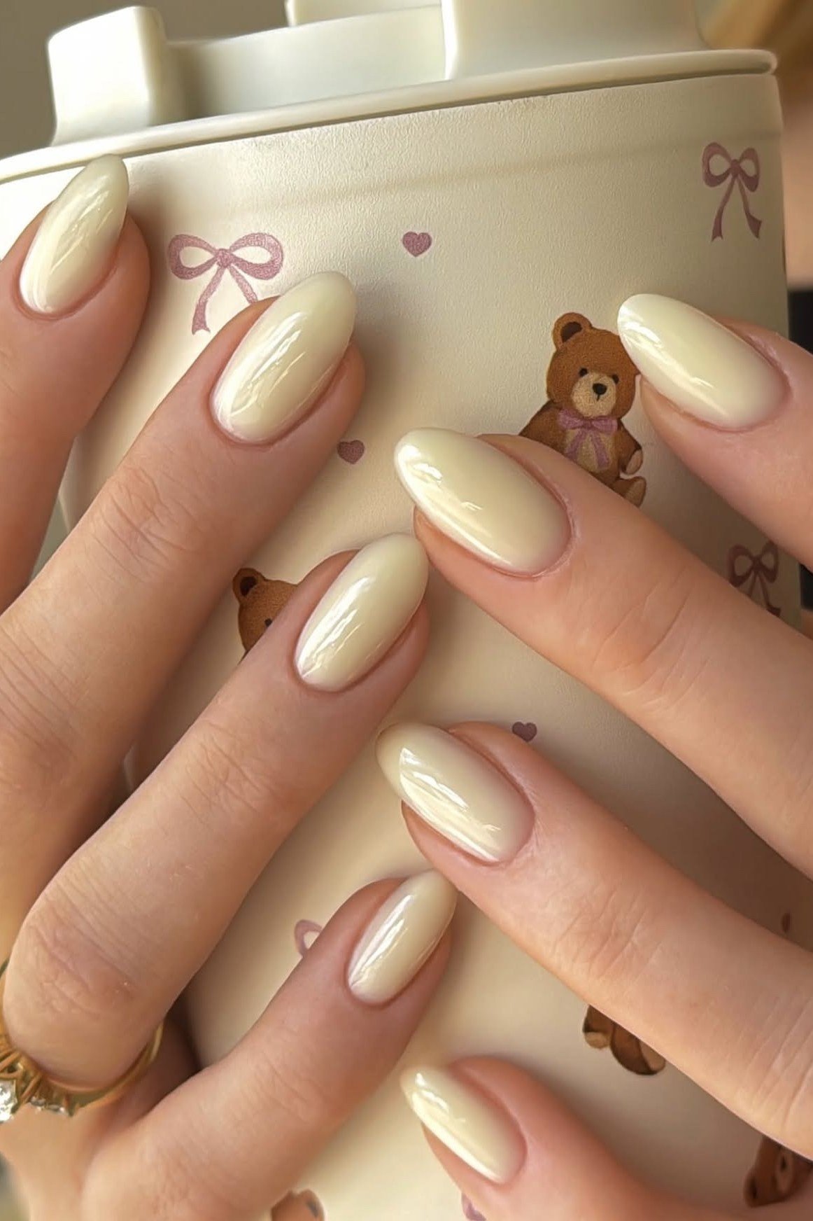Ivory Almond Nails with Coffee Cup Styling - elegant almond nail idea for women over 60