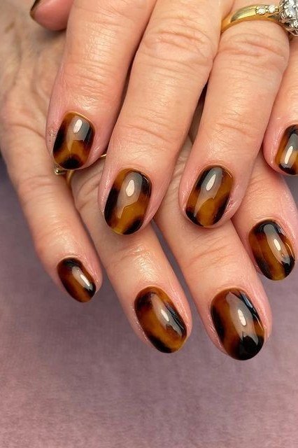 Tortoiseshell Almond Nails with Gold Rings - elegant almond nail idea for women over 60