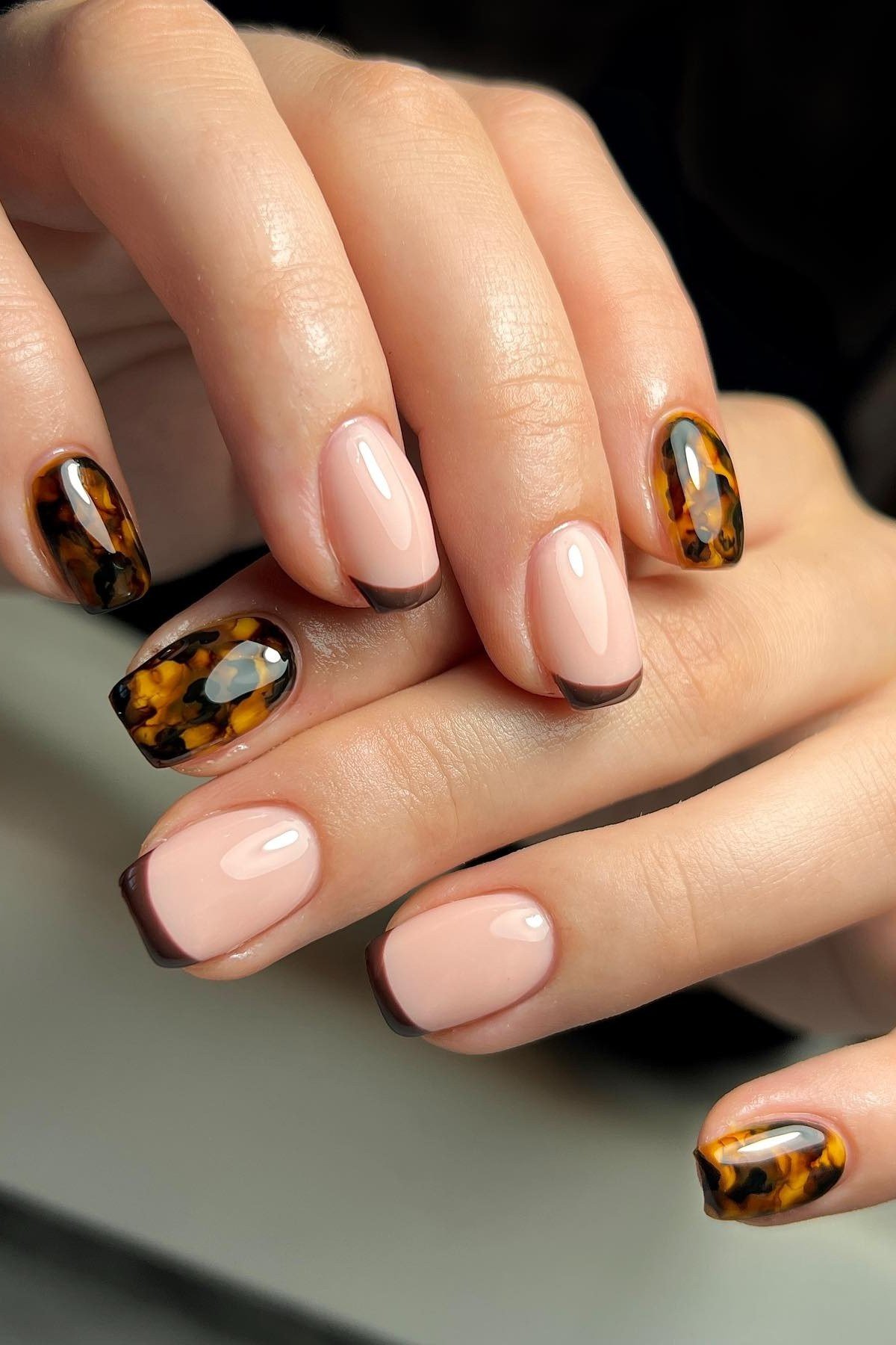 Tortoiseshell Accent on Nude Almond Nails - elegant almond nail idea for women over 60