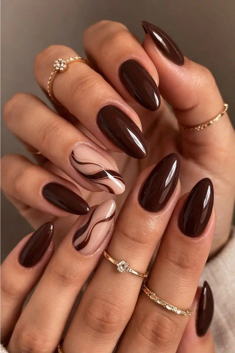 Chocolate Brown Almond Nails with Swirl Accent - elegant almond nail idea for women over 60