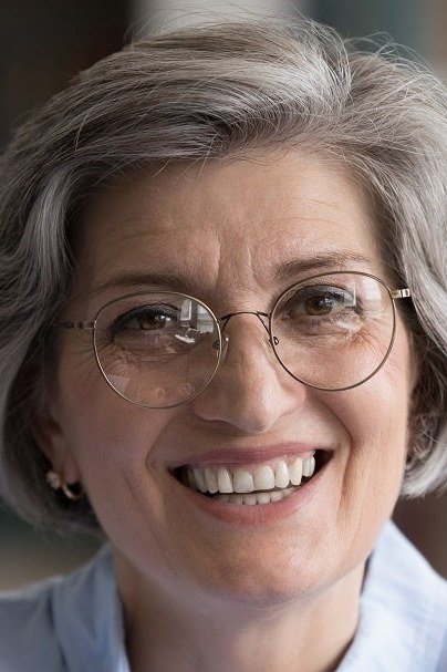 Grey layered bob with glasses for women over 50
