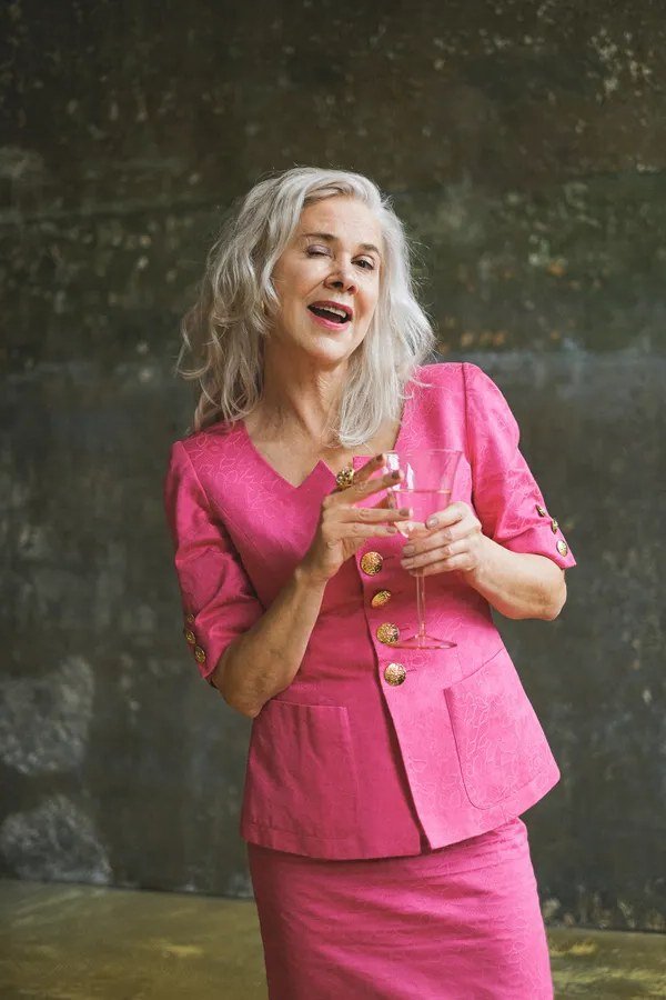 Hot pink blazer and skirt suit for older women