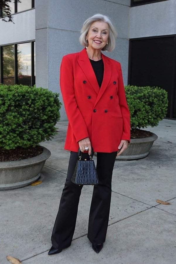 Red blazer with black trousers for older women