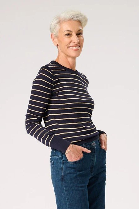 Navy and white striped sweater with blue jeans for older women