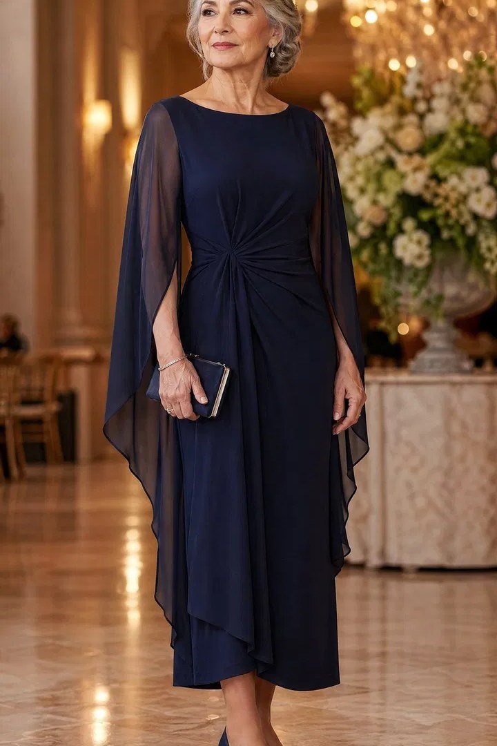 Navy cape dress in a hotel lobby for older women