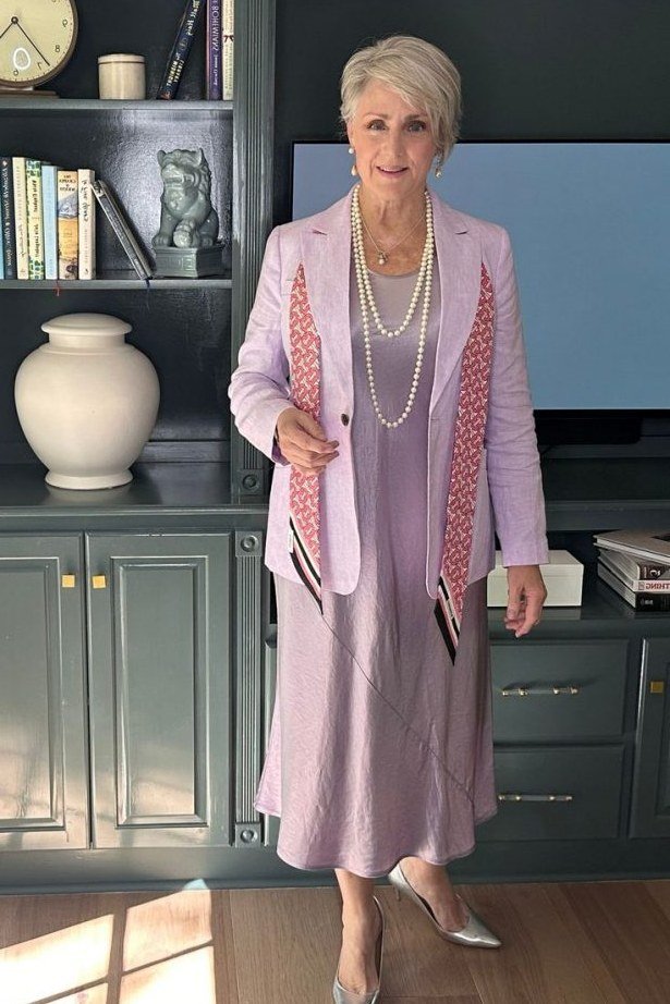 Lavender suit with pearls for older women