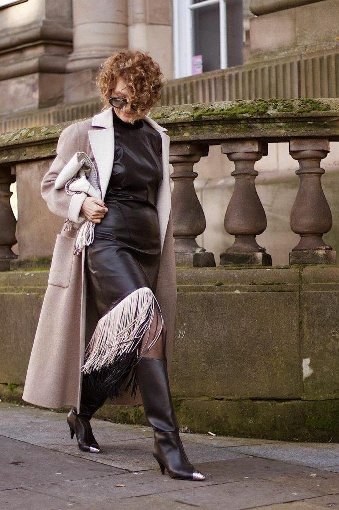 Beige trench coat with black dress and boots for older women