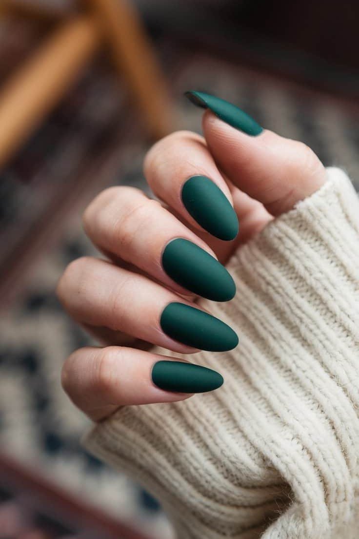 Deep Green Almond Nails with a Cozy Sweater - emerald green nail design for women over 50