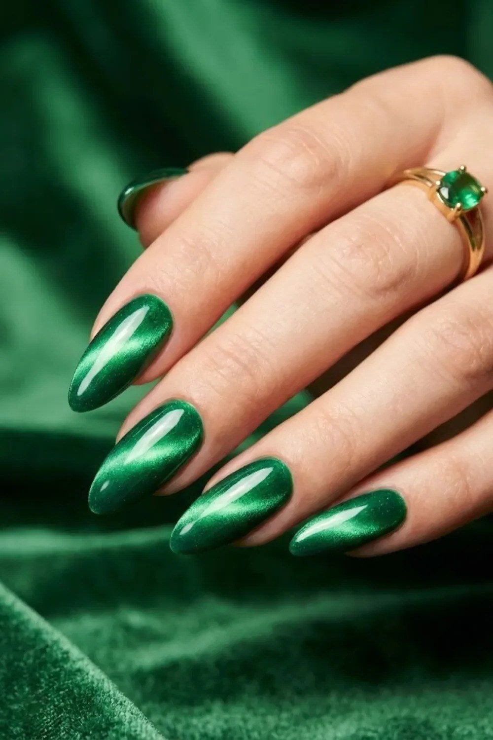 Emerald Almond Nails with a Gold Ring - emerald green nail design for women over 50