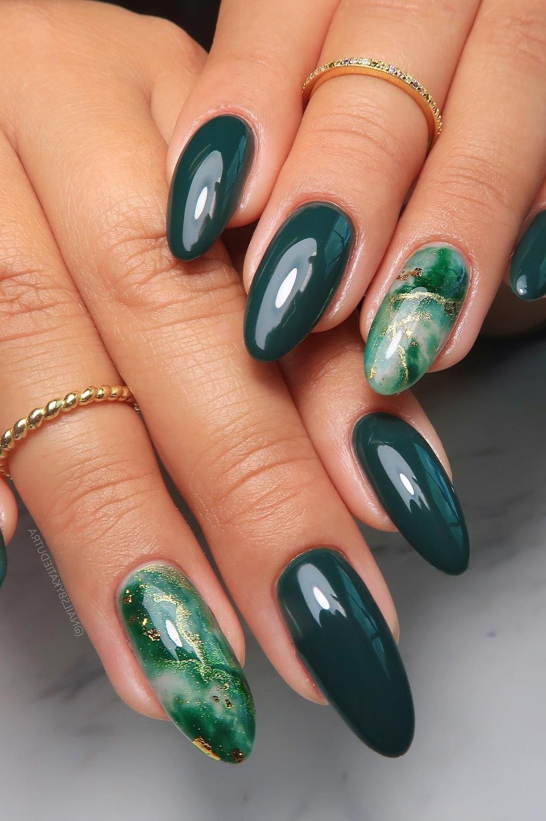 Emerald Nails with a Marble Accent - emerald green nail design for women over 50