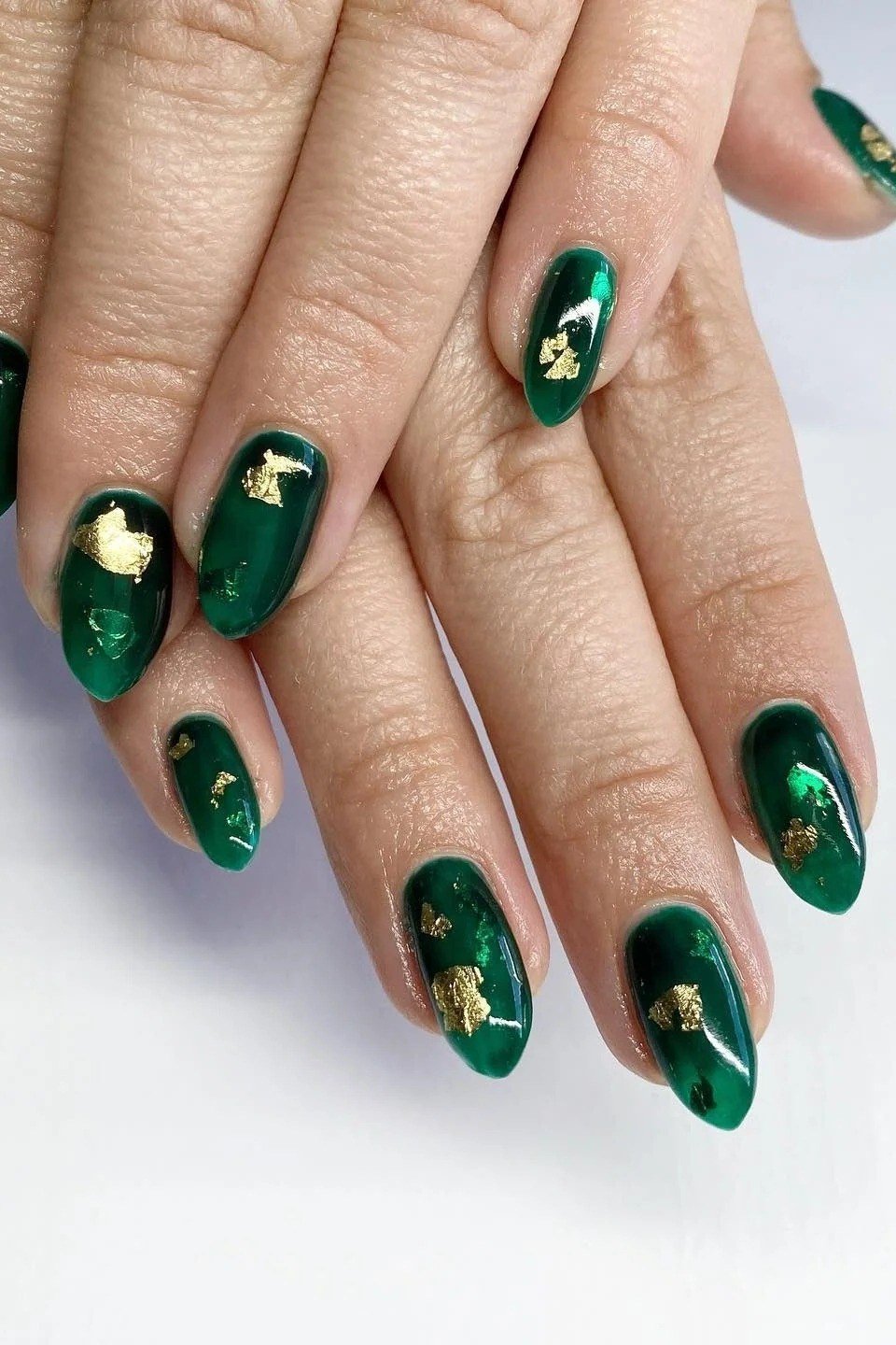 Emerald Nails with Gold Foil Flakes - emerald green nail design for women over 50
