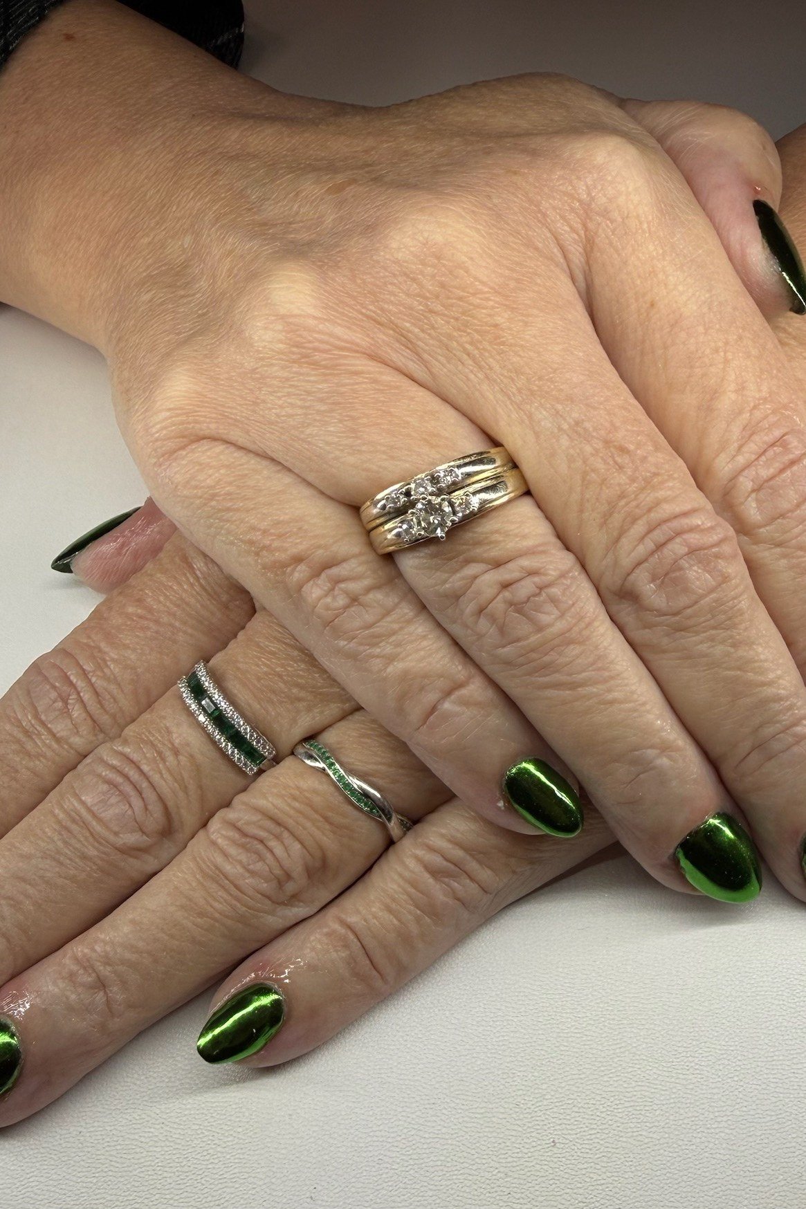 Deep Green Almonds on Mature Hands - emerald green nail design for women over 50